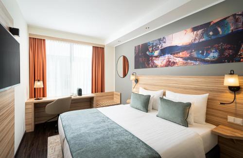 Postel nebo postele na pokoji v ubytování Leonardo Boutique Hotel Linz City Center