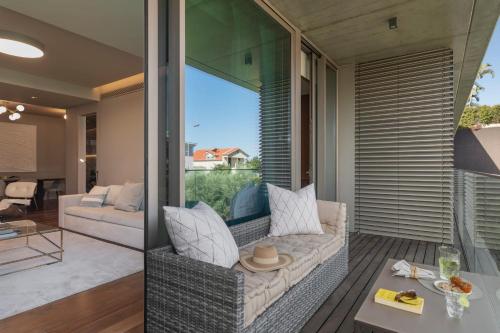 a living room with a couch and a table at Garden View - Savoy Residence Casa Branca II in Funchal