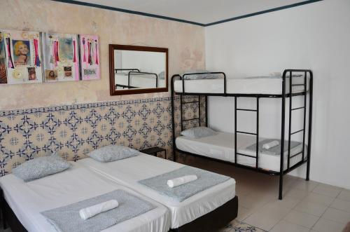 two bunk beds in a room with a mirror at RIA Terrace in Faro