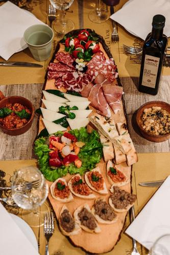 a table with a plate of food on a table at Agriturismo Villa Le Vigne in Montevarchi