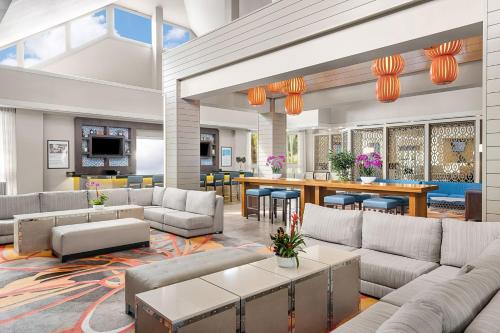 an open lobby with couches and a bar at Marriott's Cypress Harbour Villas in Orlando