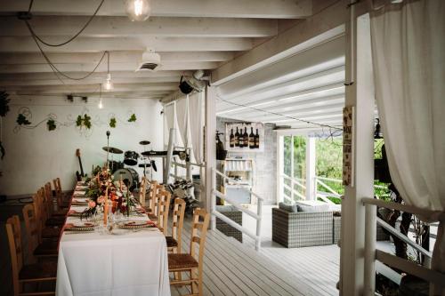 a dining room with a long table and chairs at Agriturismo Villa Le Vigne in Montevarchi