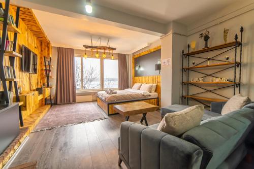 a living room with two couches and a couch at Bosphorus Menekshe Rezidances in Istanbul