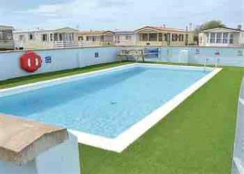a large empty swimming pool in a building at Beautiful 3 bed Static Caravan with Snowdon views in Caernarfon in Caernarfon