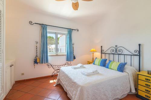 a bedroom with a bed and a window at The Old Village, Prestige and Solar by Village 4U in Vilamoura