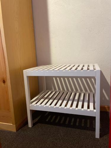 a white crib sitting in the corner of a room at Il Rifugio di Marcella in Challand Saint Anselme