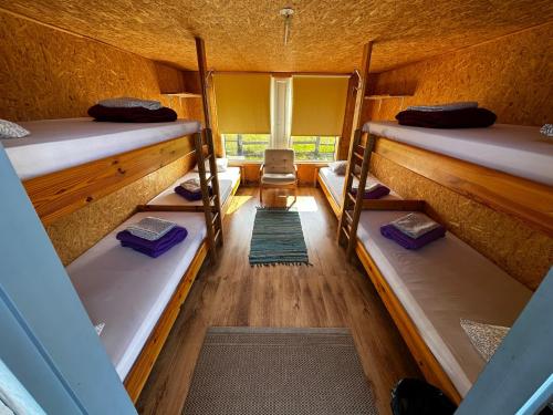 an overhead view of a room with three bunk beds at Ratturi talu in Reigi
