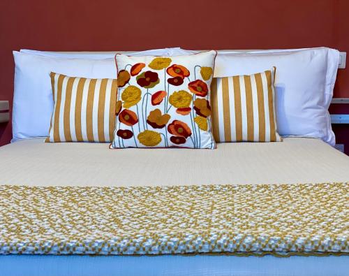 a bed with two pillows at HABITARE Lecce & Salento in Lecce