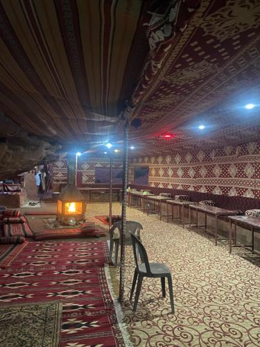 a room with a chair and a table in a theatre at Walid Bedouin Camp in Wadi Rum