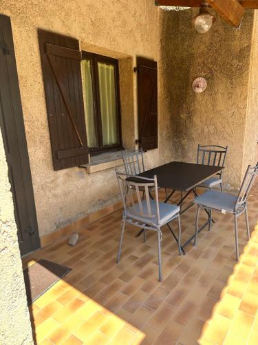 a table and chairs sitting on a patio at Residence Palmarella appartement 9 in Galeria