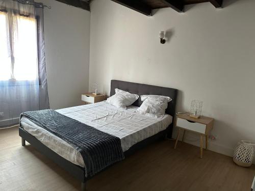 a bedroom with a large bed and a window at Residence Palmarella appartement 9 in Galeria