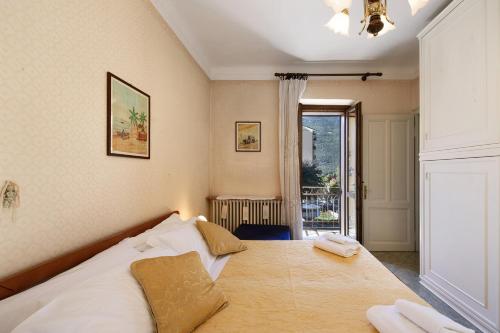 Łóżko lub łóżka w pokoju w obiekcie Villa Camillo