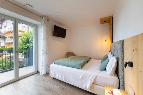 Postel nebo postele na pokoji v ubytování Hotel Alt Spaur