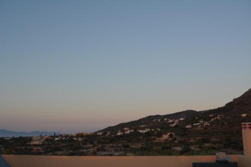 a view of a city from the roof of a house at Lily's studio in Vathí