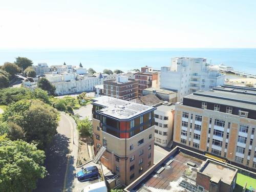an aerial view of a city with buildings and the ocean at THE PAD by the beach Penthouse apartment with sunset and city views in Bournemouth