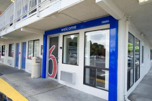 a welcome sign on the side of a building at Motel 6-Seattle, WA - Airport in SeaTac