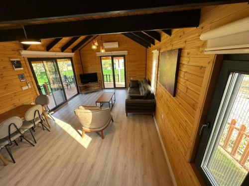 a view of a living room in a log cabin at Lake House Kayacık in Dalaman