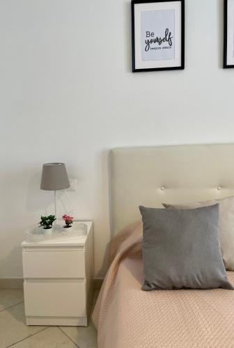 Cama o camas de una habitación en Nicole’s Appartament-a 15 min dal Duomo