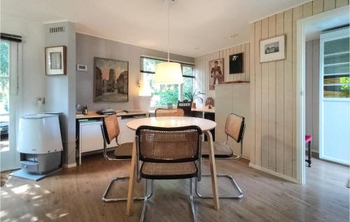 a kitchen with a table and chairs in a room at Gorgeous Home In Vorden With Wifi in Vorden