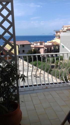 a balcony with a white railing and a view of the ocean at Bed & Breakfast 5 Di Spade in Gioiosa Marea