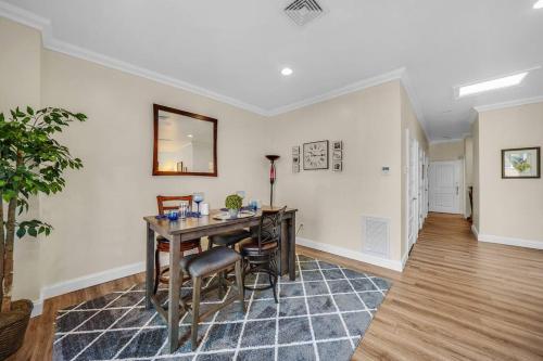 a dining room with a table and chairs in a room at Loft Apt with Balcony in the Heart of Kennett Square in Kennett Square