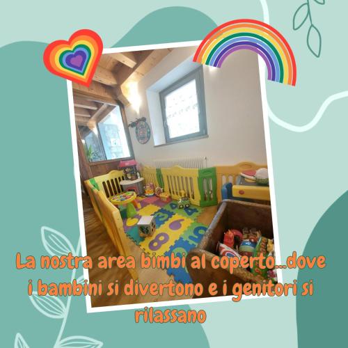 a room with a rainbow and a childs room at Rifugio Fornas in Tolmezzo