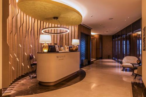 a lobby of a hotel with a reception desk at Silk Road by Minyoun in Samarkand