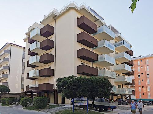 a tall building with balconies on the side of it at Residence Green Life in Bibione