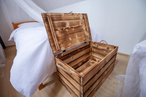 a wooden dresser sitting next to a bed at Women's Only Hostel - Female Only in Prague