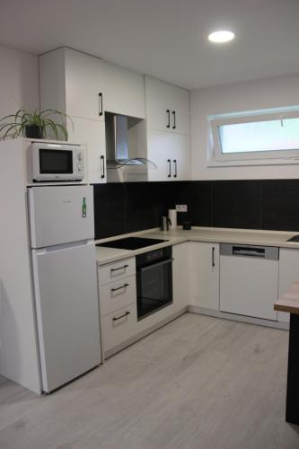 Una cocina o cocineta en Apart U Svatých