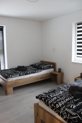 Una cama o camas en una habitación de Apart U Svatých