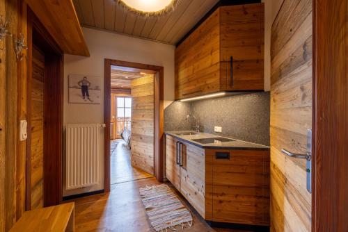 Küche/Küchenzeile in der Unterkunft Almresort Baumschlagerberg