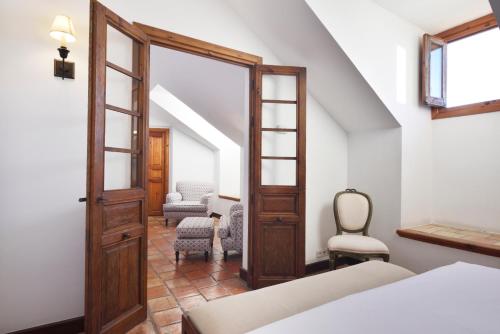 Postel nebo postele na pokoji v ubytování Hotel Puerta de la Luna