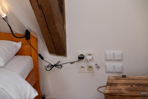 a bedroom with a bed and a lamp and a table at Women's Only Hostel - Female Only in Prague