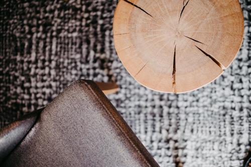 a wooden umbrella sitting on top of a table at Hotel Schützenhof in Flachau