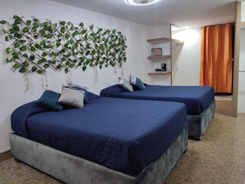 Postel nebo postele na pokoji v ubytování Hostal vitta