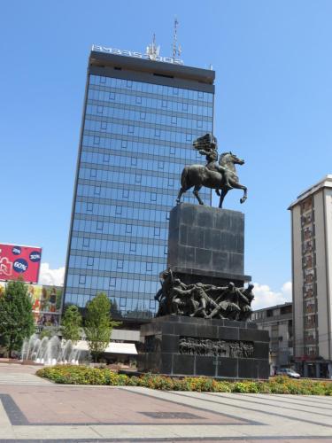 a statue of a horse in front of a building at Lux apartment 8, center, free parking in Niš