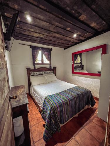Ένα ή περισσότερα κρεβάτια σε δωμάτιο στο Hostal Antigüeño