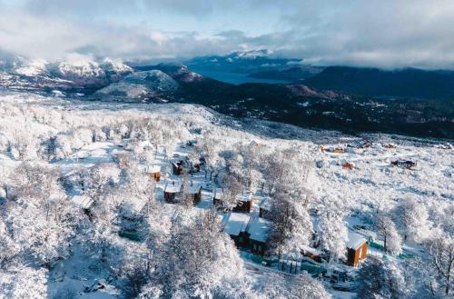 an aerial view of a village covered in snow at El Refugio Ski & Summer Lodge in San Martín de los Andes