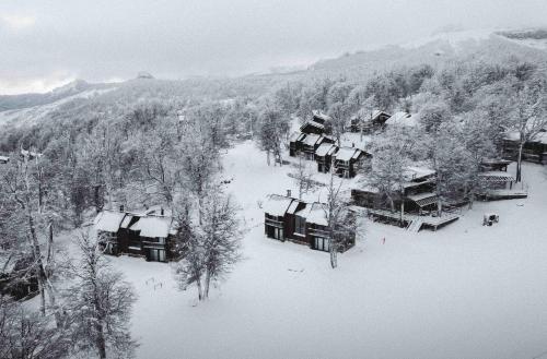 an aerial view of a ski lodge in the snow at El Refugio Ski & Summer Lodge in San Martín de los Andes