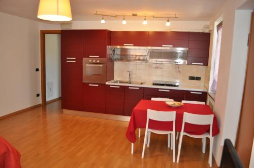 a kitchen with a table with a red table cloth on it at PEP'S HOME in Lanciano