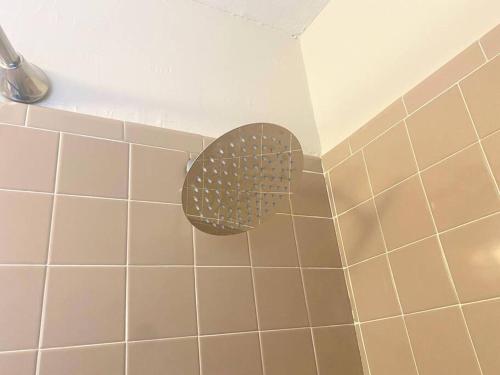 a shower with a fan in a bathroom at Classy, Spacious 1King2Full House in the Center of Norman in Norman