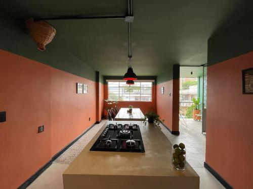 a kitchen with a stove top in a room at La Bonita Guesthouse in Bucaramanga