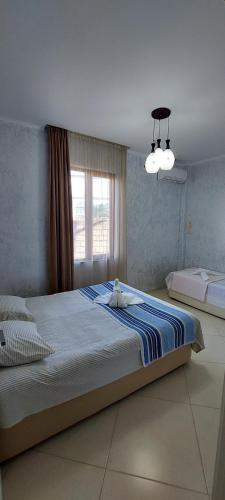 Llit o llits en una habitació de Hotel Ergo
