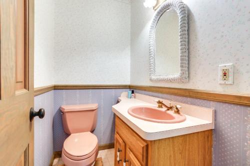 a bathroom with a pink toilet and a sink at Sparrow Bush Retreat with Pool and Screened Porch in Sparrow Bush