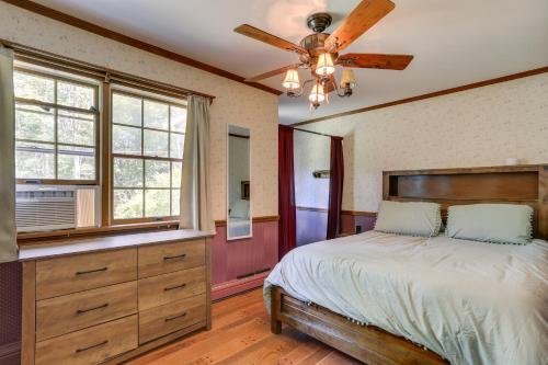 a bedroom with a bed and a ceiling fan at Sparrow Bush Retreat with Fireplace and Screened Porch in Sparrow Bush