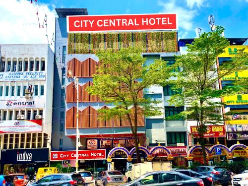 a city central hotel sign on a busy city street at City Central Hotel in Kuala Lumpur