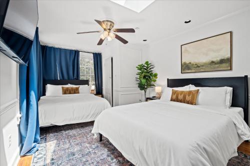 a bedroom with two beds and a ceiling fan at The W House Traveler's Dream Heart of Old Town in Alexandria