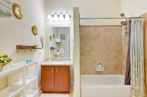a bathroom with a tub and a sink and a shower at Downtown Baltimore Vacation Rental WFH Friendly! in Baltimore