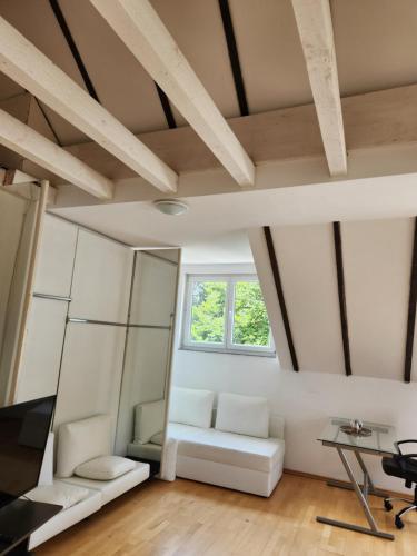 a room with white furniture and a window at villa high ceiling 2 bedrooms in Troisdorf